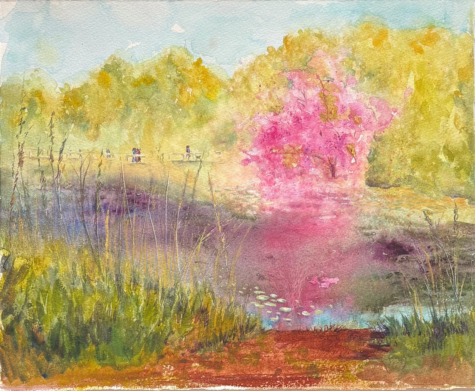A vivid green-and-pink landscape with a large blossoming pink tree, a central pond, and people crossing a distant bridge — watercolour by Claudia Fernandez
