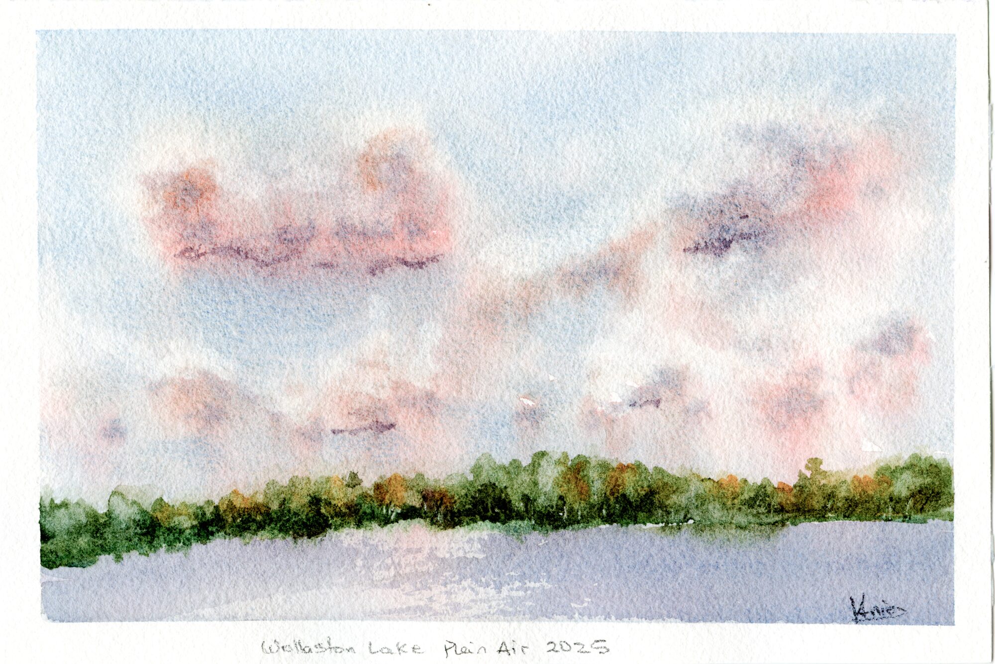A pale blue sky filled with soft pink and peach clouds over a calm lake, with a dark green tree-lined shore across the water — watercolour by Claudia Fernandez