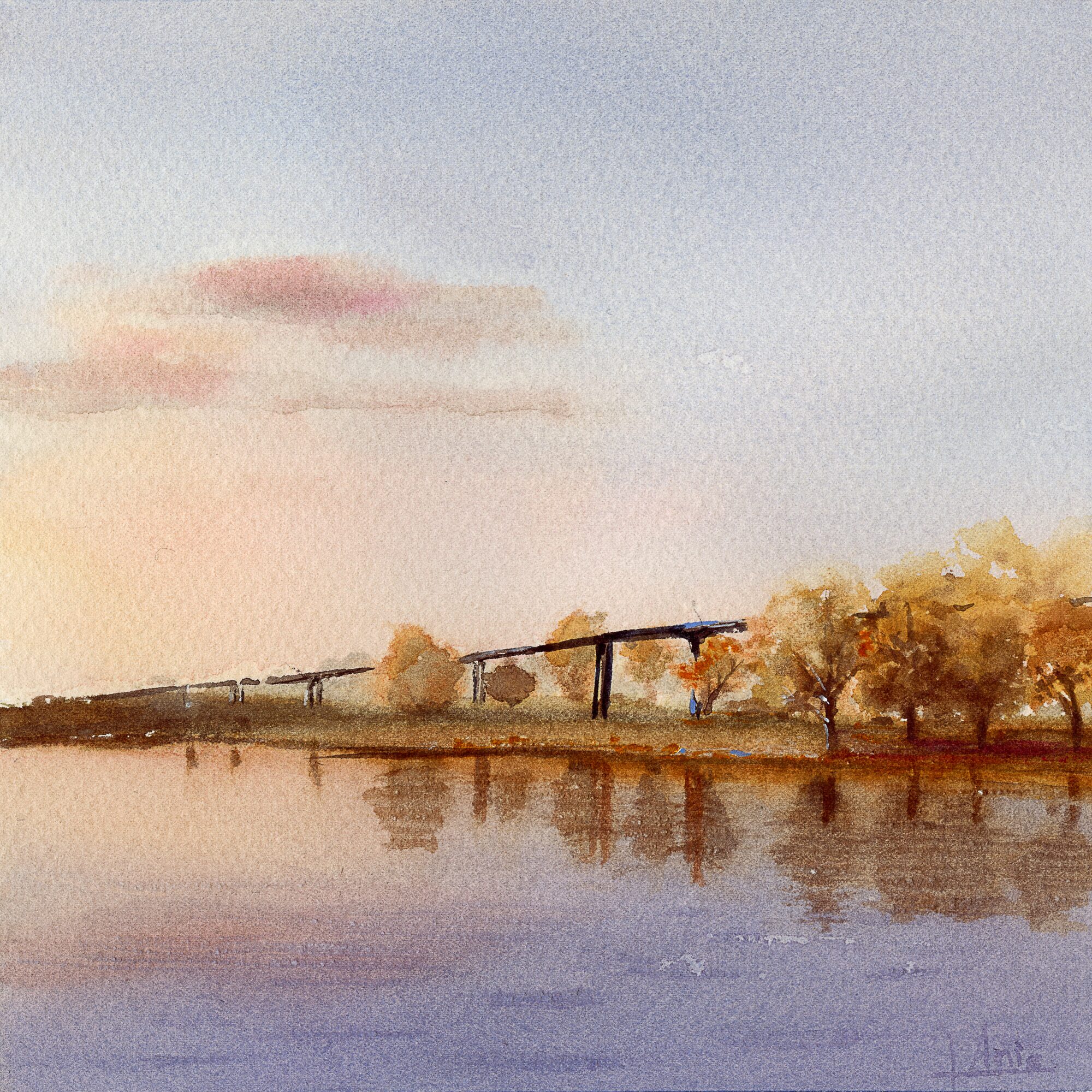 A bridge crossing a river at sunset, with fall-coloured trees reflected on the still water, in soft, warm yellows, browns and pinks — watercolour by Claudia Fernandez